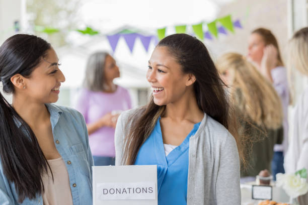 istock Attractive female volunteers during charity event 964288432