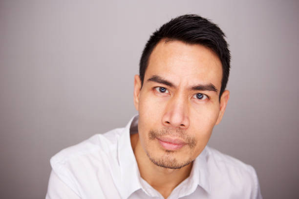 istock Mature asian man staring at camera 964289396