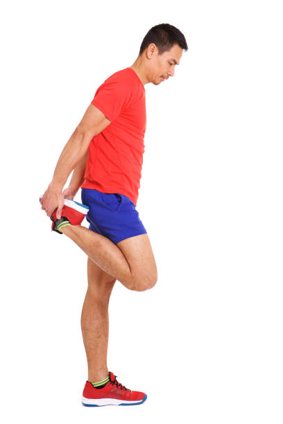 istock Fit mature asian man stretching his legs muscles 964291850