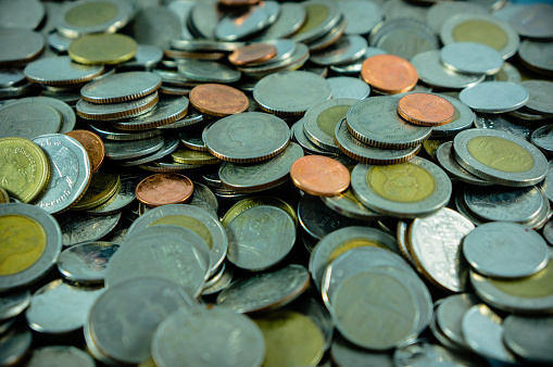 Coins, a lot of coins thai currency. image for background, wallpaper and copy space. sign of financial and business of south east asia, SEA.saving money and Sluggish economy concept.