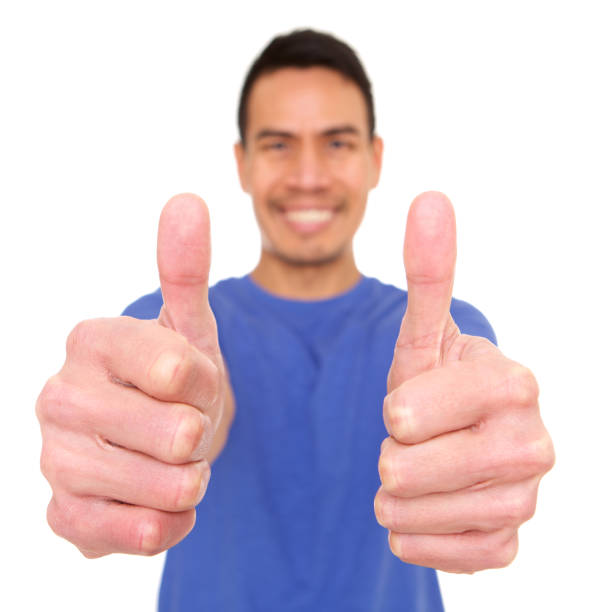 istock Smiling mature asian man giving thumbs up 964292102