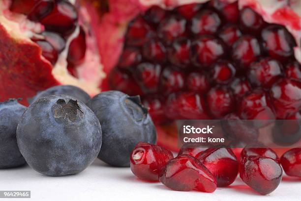 Pomegranate And Blueberries Stock Photo - Download Image Now - Berry Fruit, Blueberry, Chopped Food