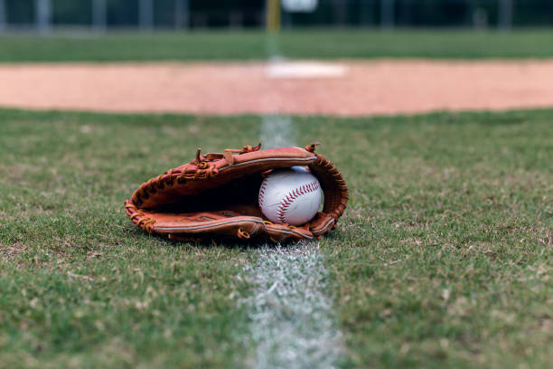 istock Baseball glove on foul line 964300542
