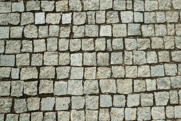istock Old paving and square stones - retro background 964304634