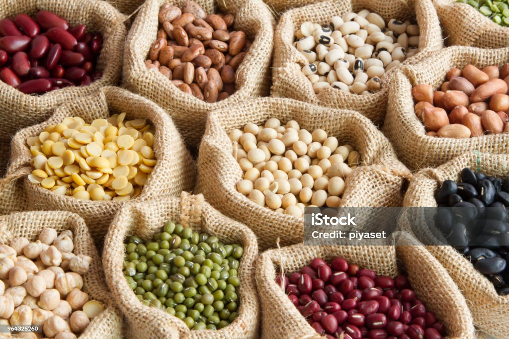 various of legumes in sack bag various of legumes in sack bag. organic food and creation of natural product concept. Legume Family Stock Photo