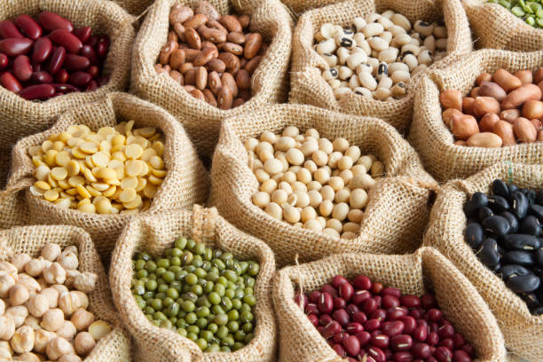 various of legumes in sack bag various of legumes in sack bag. organic food and creation of natural product concept. legume family stock pictures, royalty-free photos & images