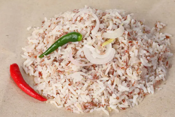 Photo of Nasi dagang mixed unpolished wild rice cooked with coconut milk spiced with onion garlic ginger chilli served with fish or chicken coconut curry