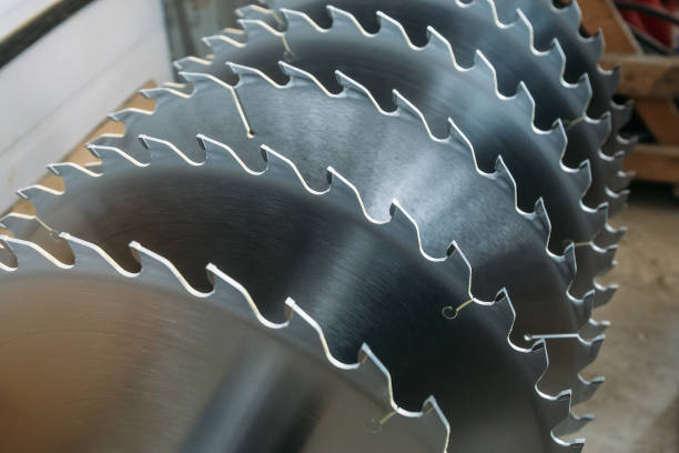 istock Metal silver circular saw blades for wood work as industrial tool background 964329460