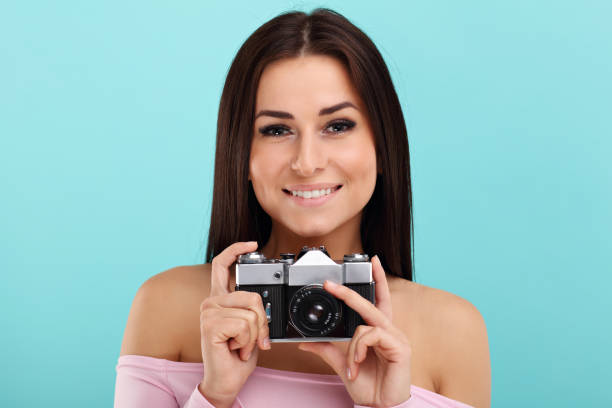 istock Woman against blue wall background 964330002