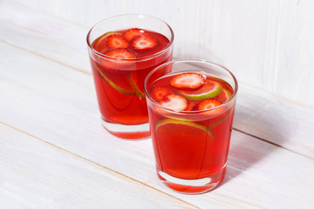 istock two glasses of strawberry-citrus lemonade on a white background 964342704