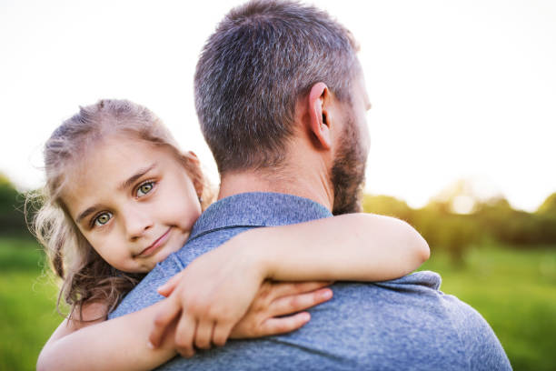 istock Father with a small daughter having fun in spring nature. 964344164