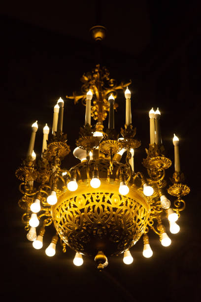istock Big chandelier with energy saving bulbs at cathedral 964348872