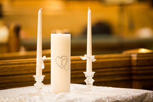 Wedding ceremony candles in church to be lit