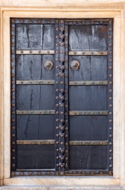 istock Antique rustic ancient wooden door. 964357184