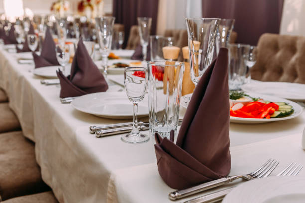 istock rich table in the restaurant, empty white dishes, glass glasses, Cutlery 964358520