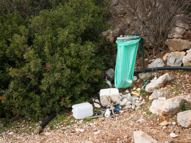 istock Green trash bag and rubbish 964362560