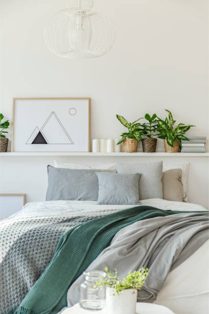 istock Grey and green bedroom interior 964364240