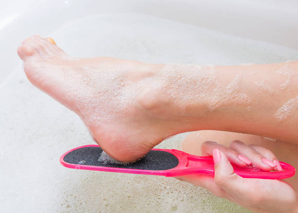 https://media.istockphoto.com/id/964366408/photo/pumice-foot-file-young-woman-removing-hard-skin-on-her-foot-with-pumice-stone-part-of-body.jpg?s=612x612&w=0&k=20&c=L0-5BxNNi8o-wGnQ3ZIbNMRMMjVFO8CHOF8dxLXhP6s=