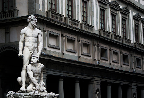 Hercules and Cacus stand tall before Uffizi Gallery of Florence reflecting strength and power of Italy in the past
