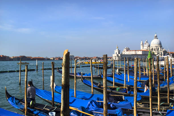 Cover Gondolas on a raining day in Venice