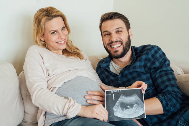 istock Happy couple expecting a baby 964383686
