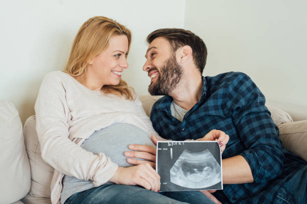 istock Pregnant woman with her husband 964383750