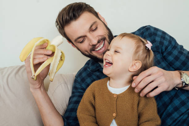 istock Happy family eating fruit 964384484