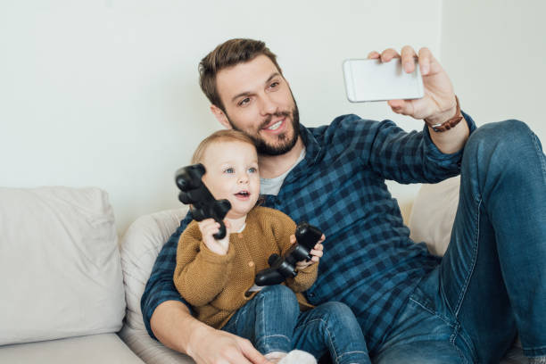 istock Father and daughter making a selfie 964384616