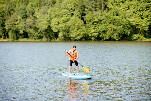 istock Man swimming on the paddleboard 964391722