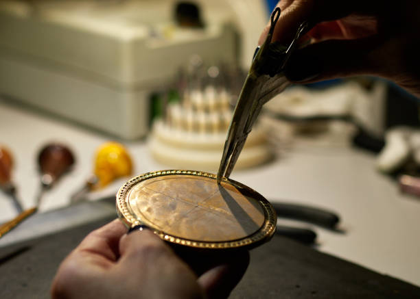 istock The engraver places a marking on the medal over the paste. 964391844