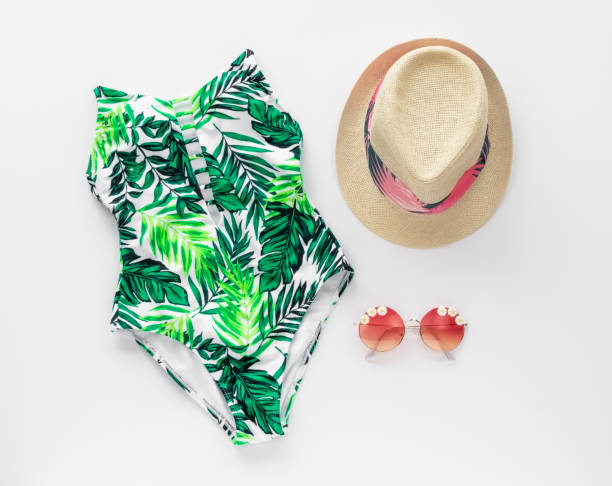 istock Palm Leaf Print Swimming Suit, Hat, Sunglasses Flat Lay Design Template 964392110