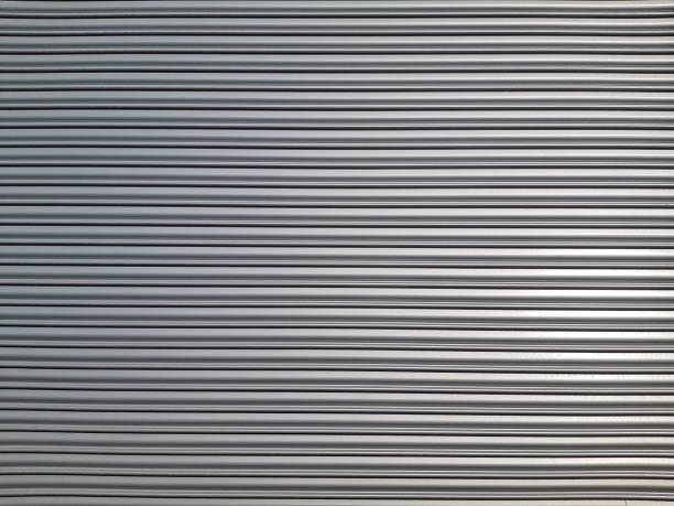 istock Old metal blinds painted with thick layer of light paint as background 964395518