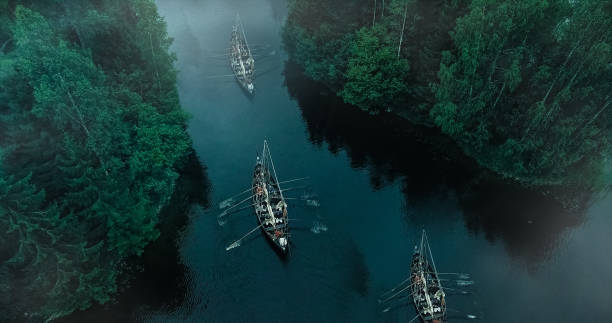 aerial shot of a sailing viking row ships on river. medieval reenactment. - sea battle imagens e fotografias de stock