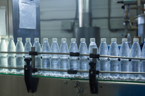 istock Closeup on mineral water bottles in raw and lines 964409514