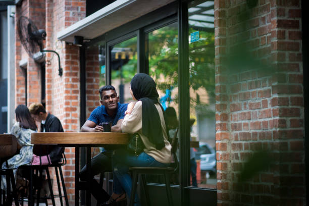 istock Couple chatting at a cafe 964409518