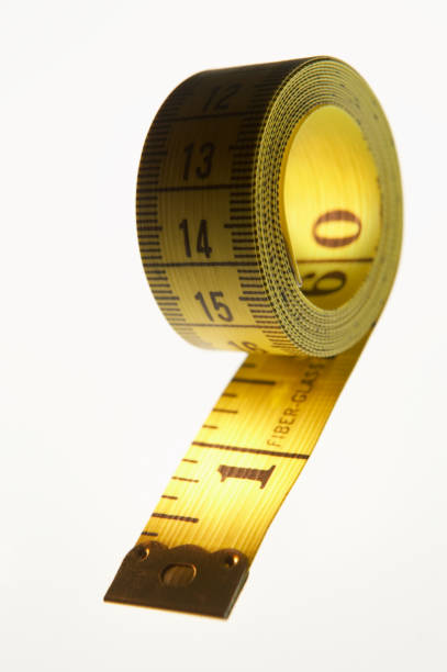 istock YELLOW MEASURING TAPE ISOLATED ON WHITE BACKGROUND 964414450