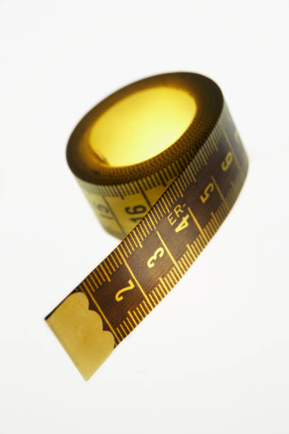 istock YELLOW MEASURING TAPE ISOLATED ON WHITE BACKGROUND 964415256