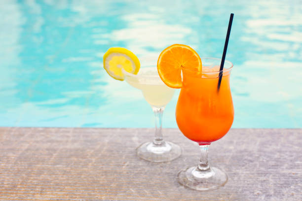 istock Glasses of tropical cocktail on poolside 964426098