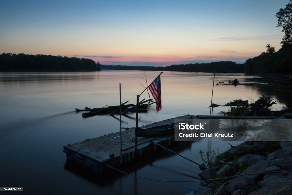 Calm Missouri River Sunset over the Missouri River at Cooper's Landing, near Columbia. American Flag Stock Photo