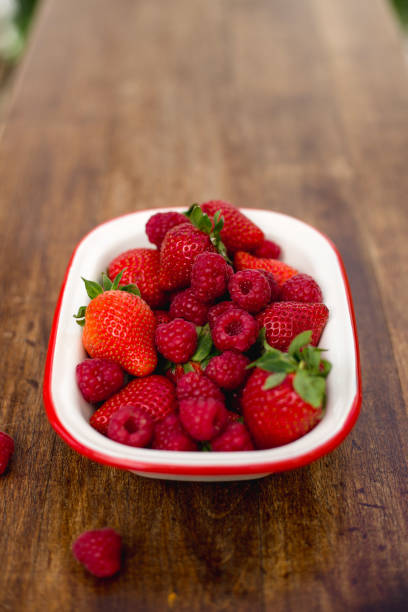 istock strawberry and rapsberry. Summer concept 964426200