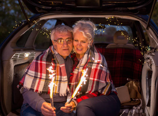 istock Senior couple outdoors with car 964433394