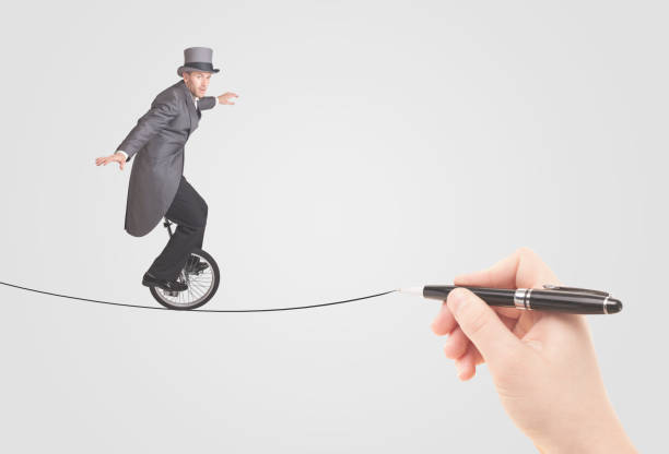 istock Businessman riding monocycle on a rope drawn by hand 964437842