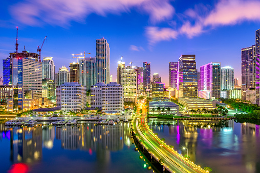 Miami, Florida, USA downtown skyline over Biscayne Bay at night.