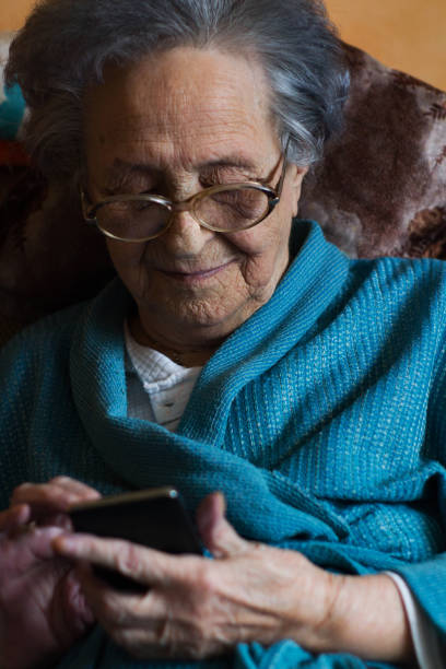 istock Elder lady with phone 964443228