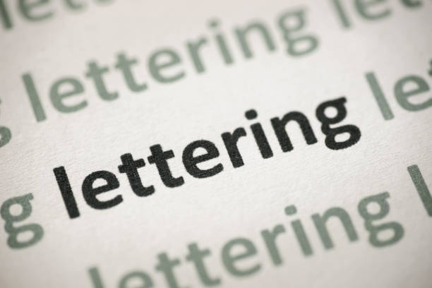 istock word lettering printed on paper macro 964445760