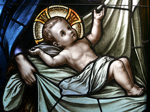 Baby Jesus in Swaddling Clothes Stained Glass Window