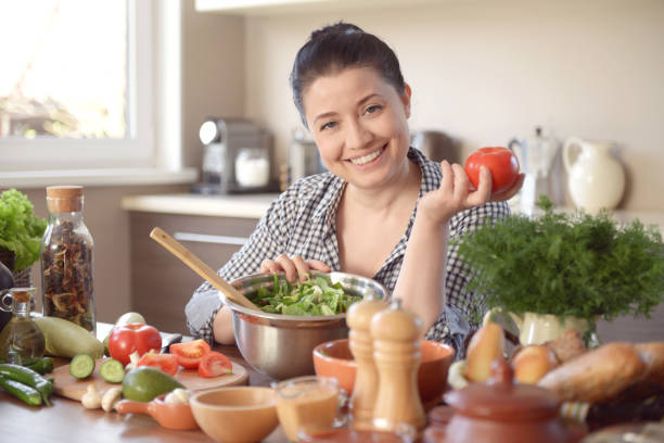 istock woman cooking in the kitchen 964449238