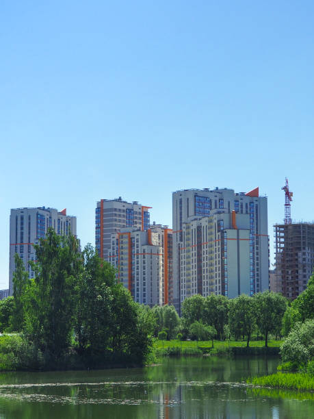 istock City park under blue sky with downtown skyline in the background 964453114