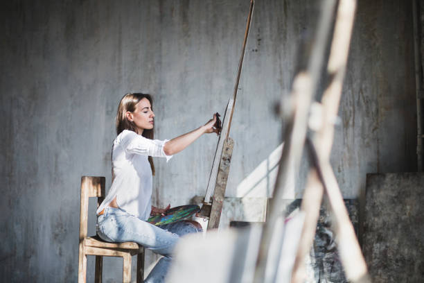 istock Modern artist painting oilpaints in studio. 964454004