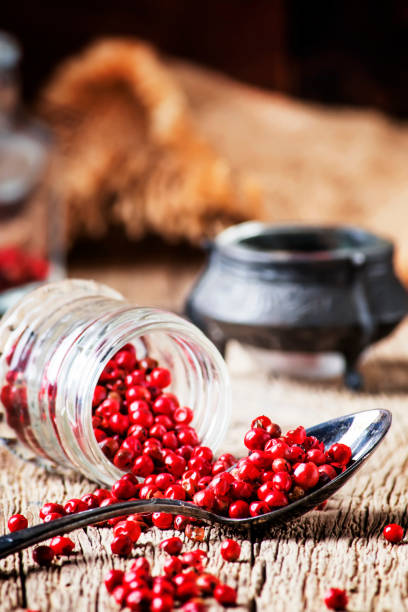 istock Pink pepper in spoon and jar 964454026